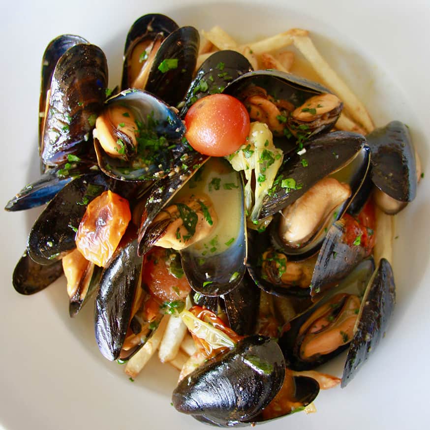 Prince edward island mussels with garlic herb butter and pommes frites at The Bistro restaurant in Jackson, Wyoming.