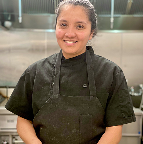 Portrait of Fine Dining Restaurant Group back of house employee of the month, Jimena Corona, in the kitchen of The Bistro Restaurant in Jackson, Wyoming.
